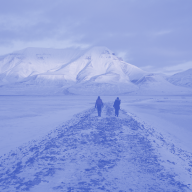 two people walking down a path in the arctic